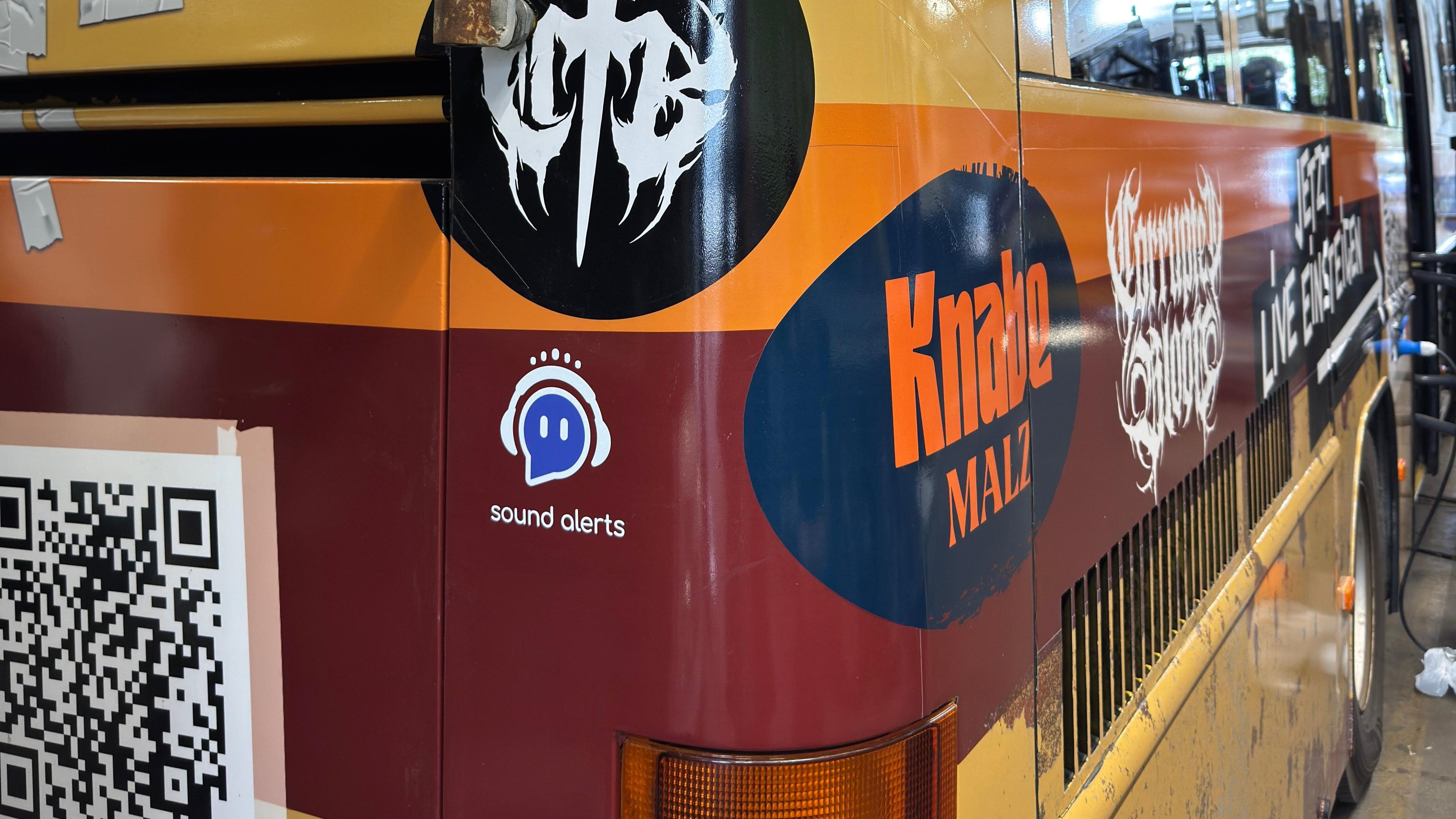 This image shows the logo of Sound Alerts on a streaming IRL bus.